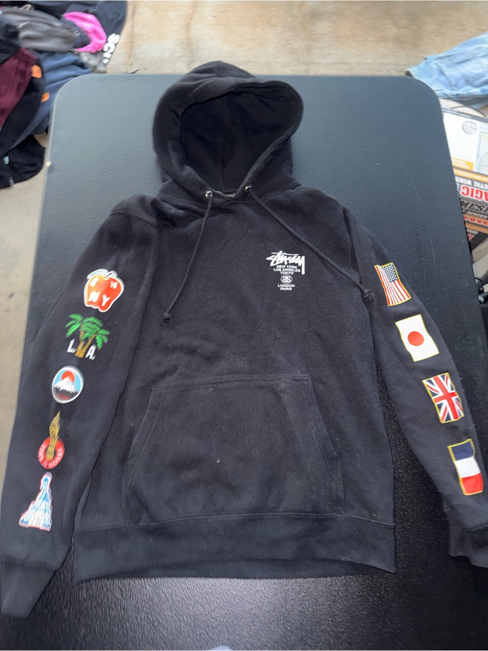 Stussy world tour Black Hoodie with Multicolor Sleeve Patches